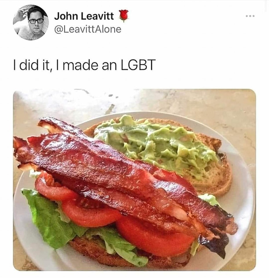 The meme is a humorous image of a sandwich with multiple layers of bacon, lettuce, and tomato, implying that the creator has made a sandwich that is so extravagant and excessive that it's a joke about their identity as LGBTQ+ (Lesbian, Gay, Bisexual, Trans, and others). The text in the image reads: "I did it, I made an LGBT".